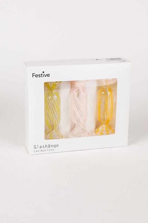 Glashänge i tre färgglada modeller, inklusive gul, rosa och grön, för dekoration och festliga tillfällen. Förpackad i en vit låda med genomskinlig front.