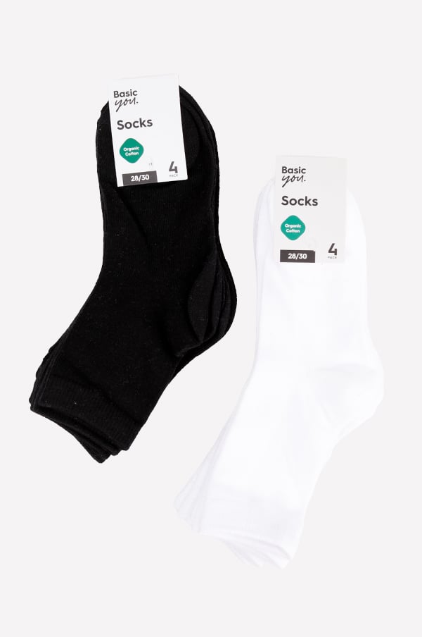 Svarta och vita strumpor i ekologisk bomull, förpackade i ett set av fyra. Storlek 28/30. Perfekta för vardagsbruk och komfort.